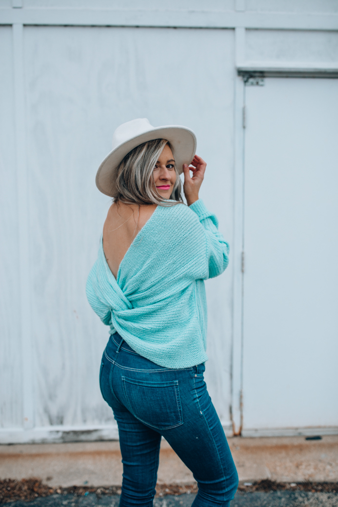 Chicago fashion blogger Happily Inspired shares a cute open back sweater that's under $50! This sweater gave me some of my postpartum blues back!