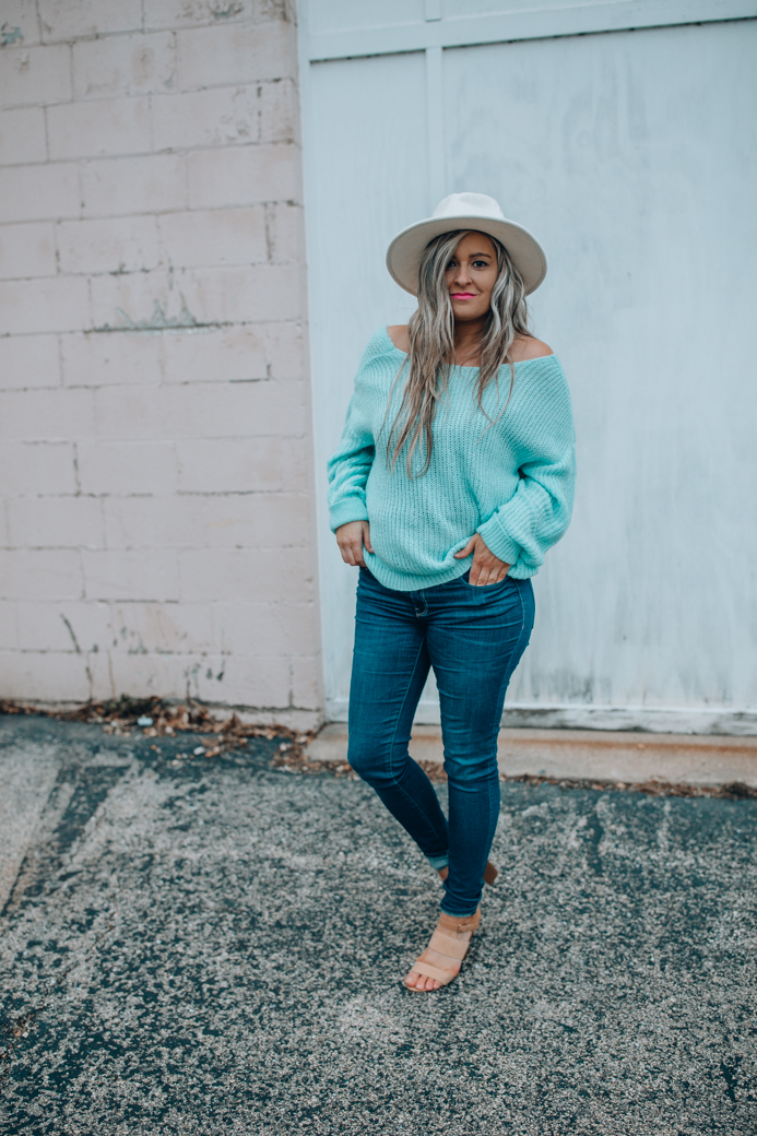Chicago fashion blogger Happily Inspired shares a cute open back sweater that's under $50! This sweater gave me some of my postpartum blues back!