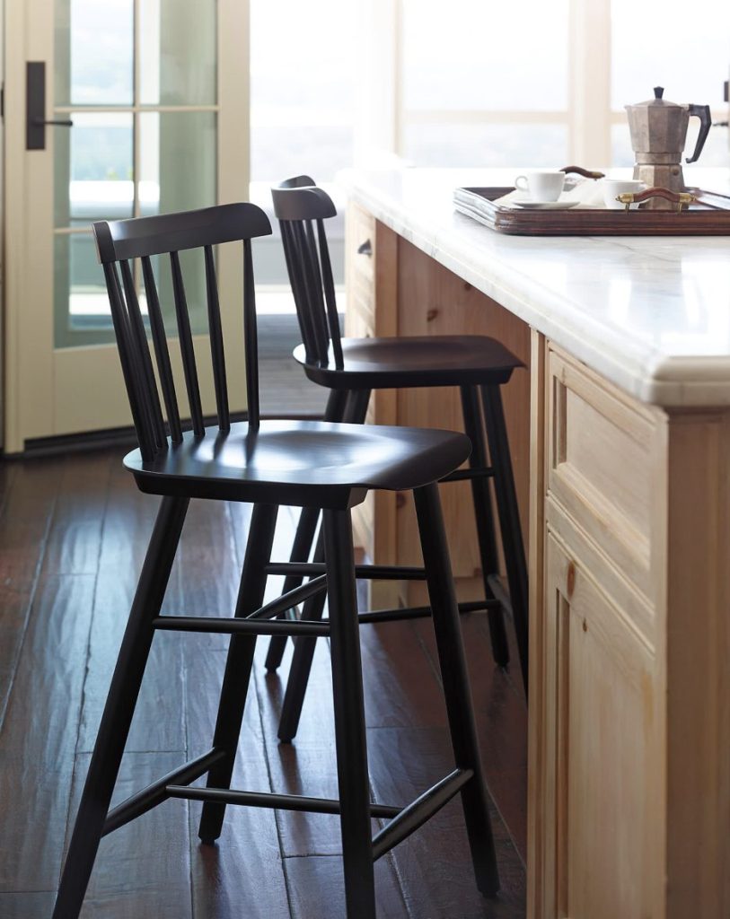 black farmhouse wooden bar stools at kitchen counter.