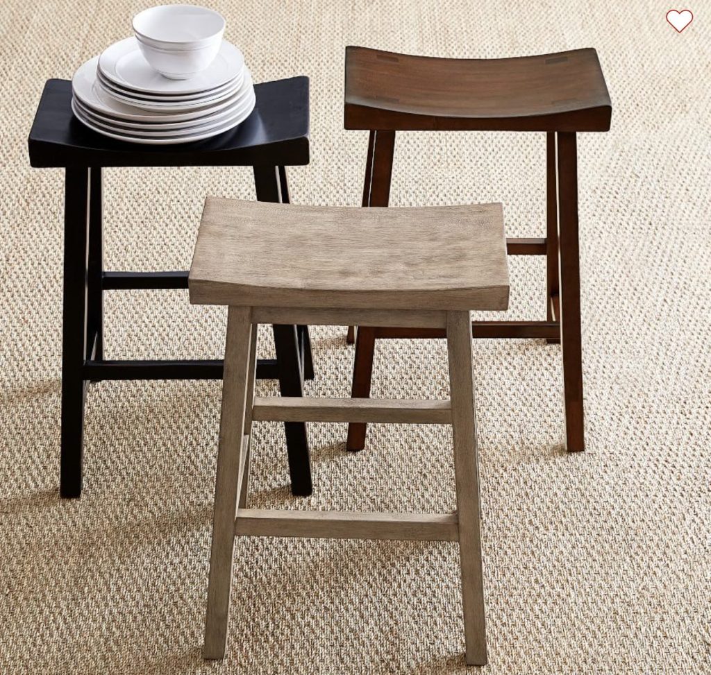 wooden bar stools with no backs.