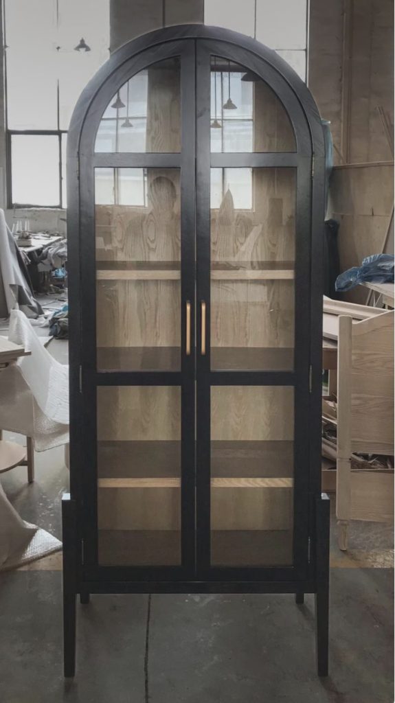 black arched cabinet