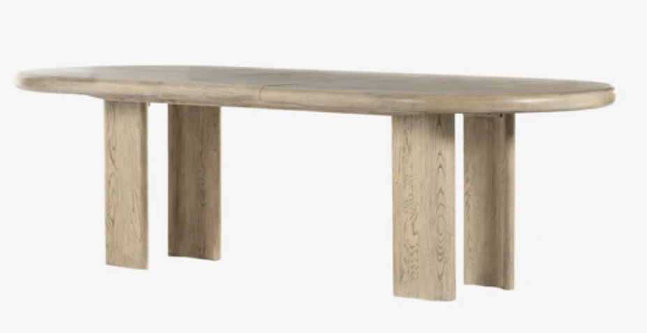 solid oak dining table that can expand for gathering needs. 