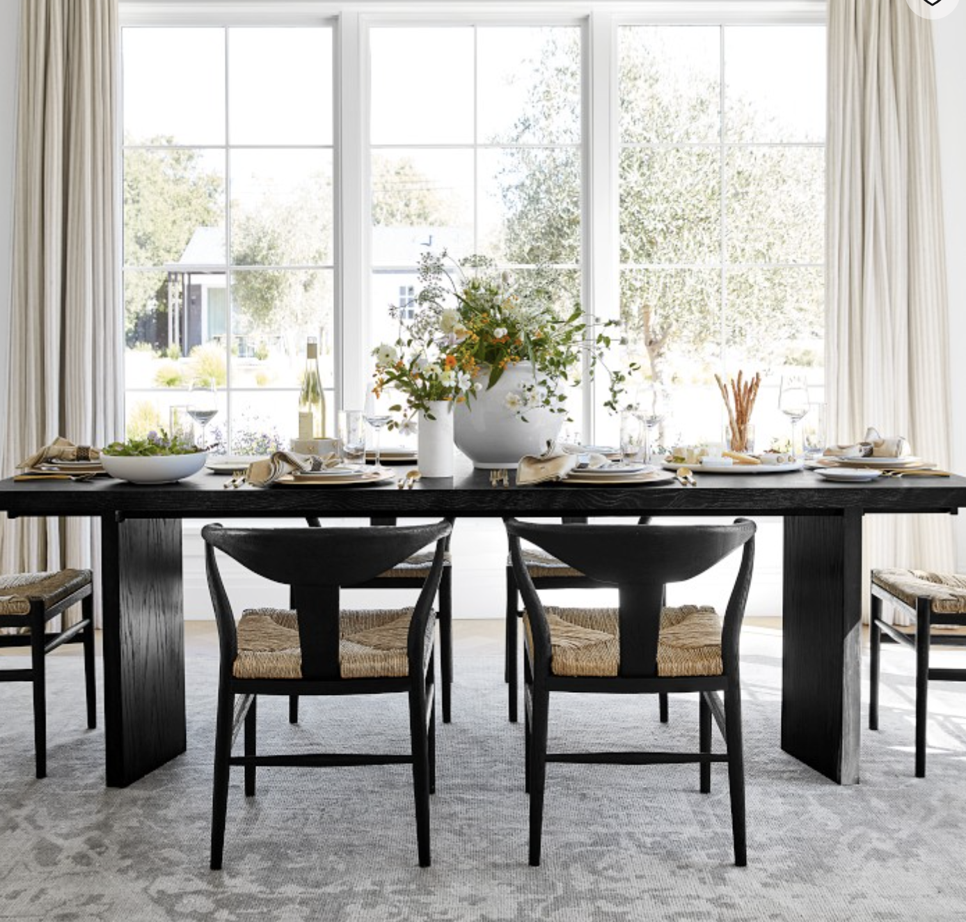 black expandable dining table that seats 6. 