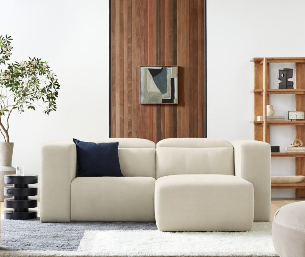 white reclining sectional for small spaces and large armrests.