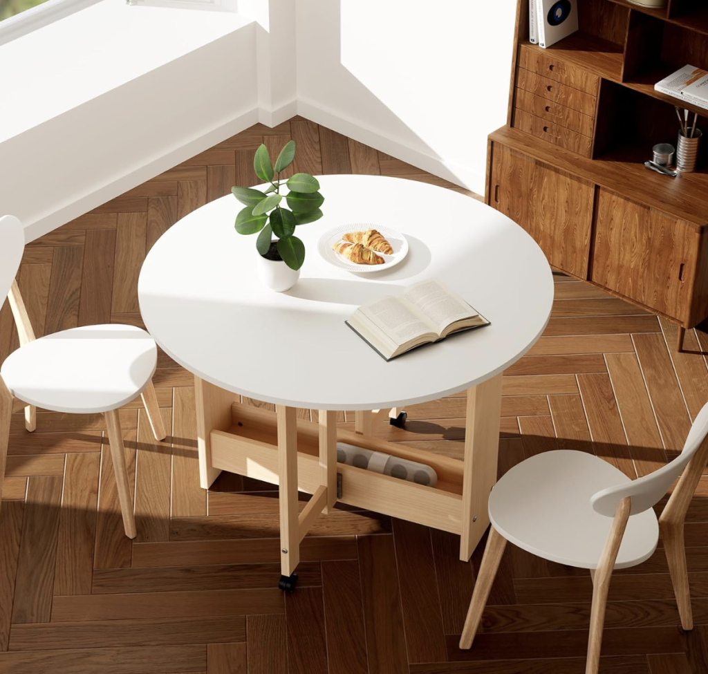white round leaf drop table with wood legs. 