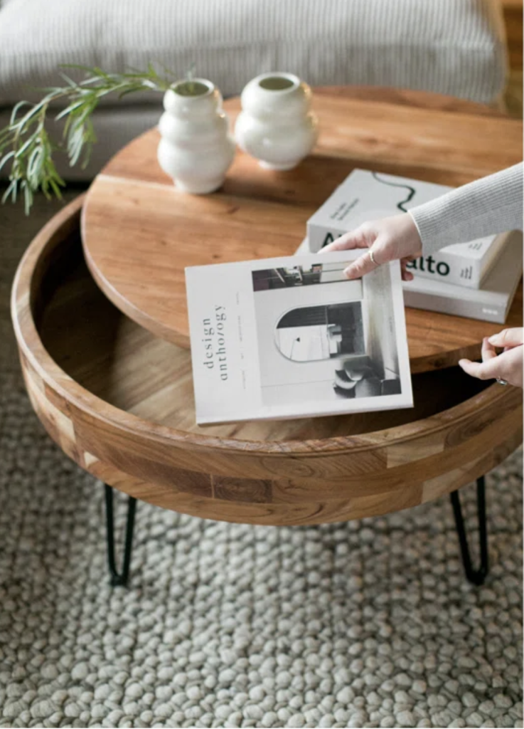 round wood coffee table with lift top storage that can store small items like books and accessories from your living room. 