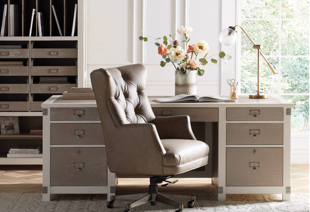 leather office chair at a desk with flowers.