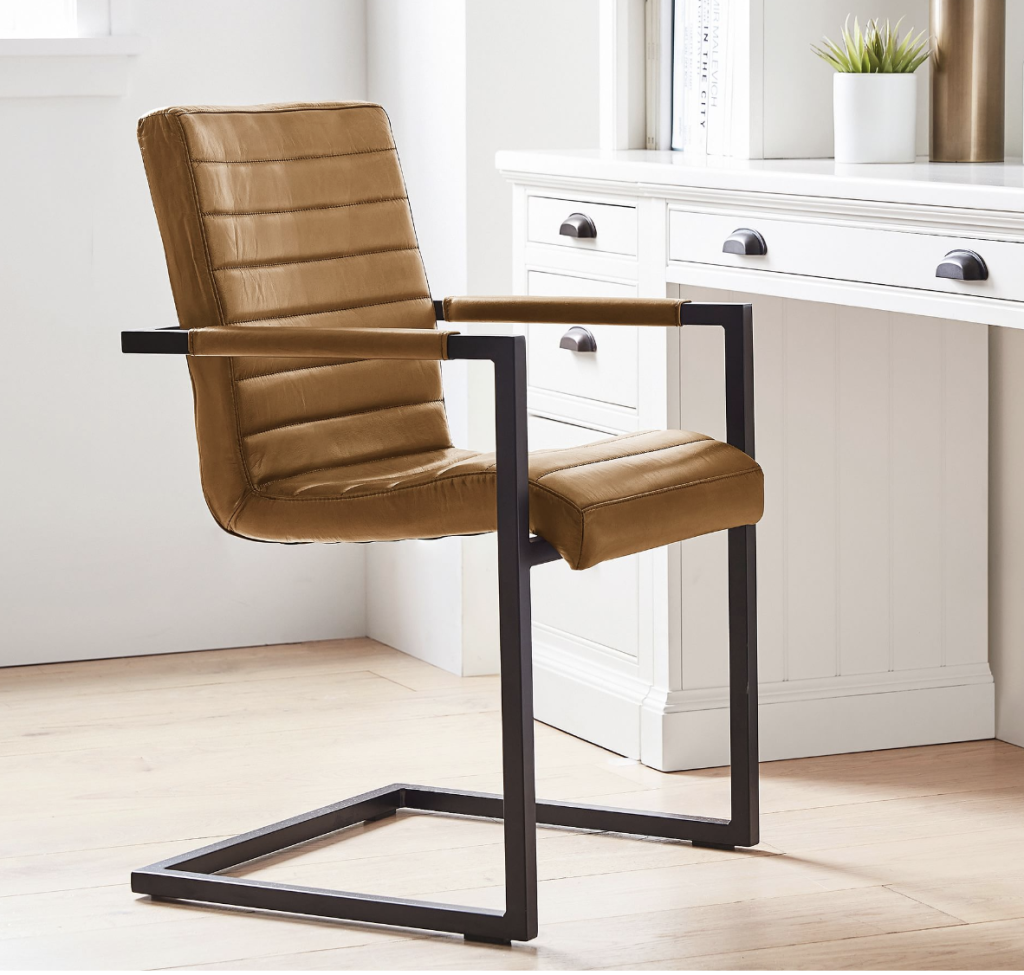 brown leather modern desk chair with black legs. 