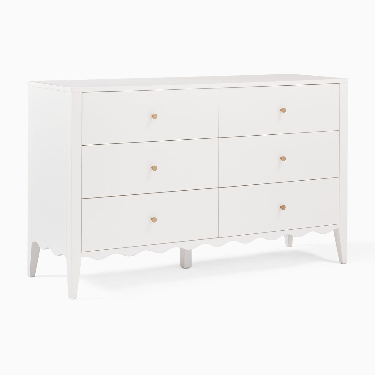 white scalloped dresser with gold knobs and scalloped design at the base. 