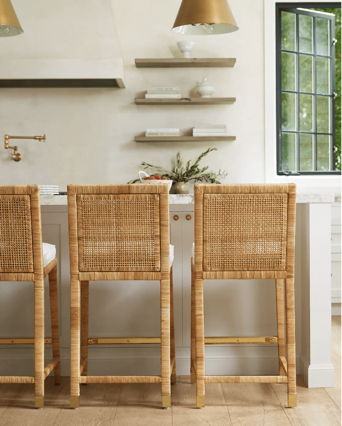 rattan bar stools at a kitchen island. 