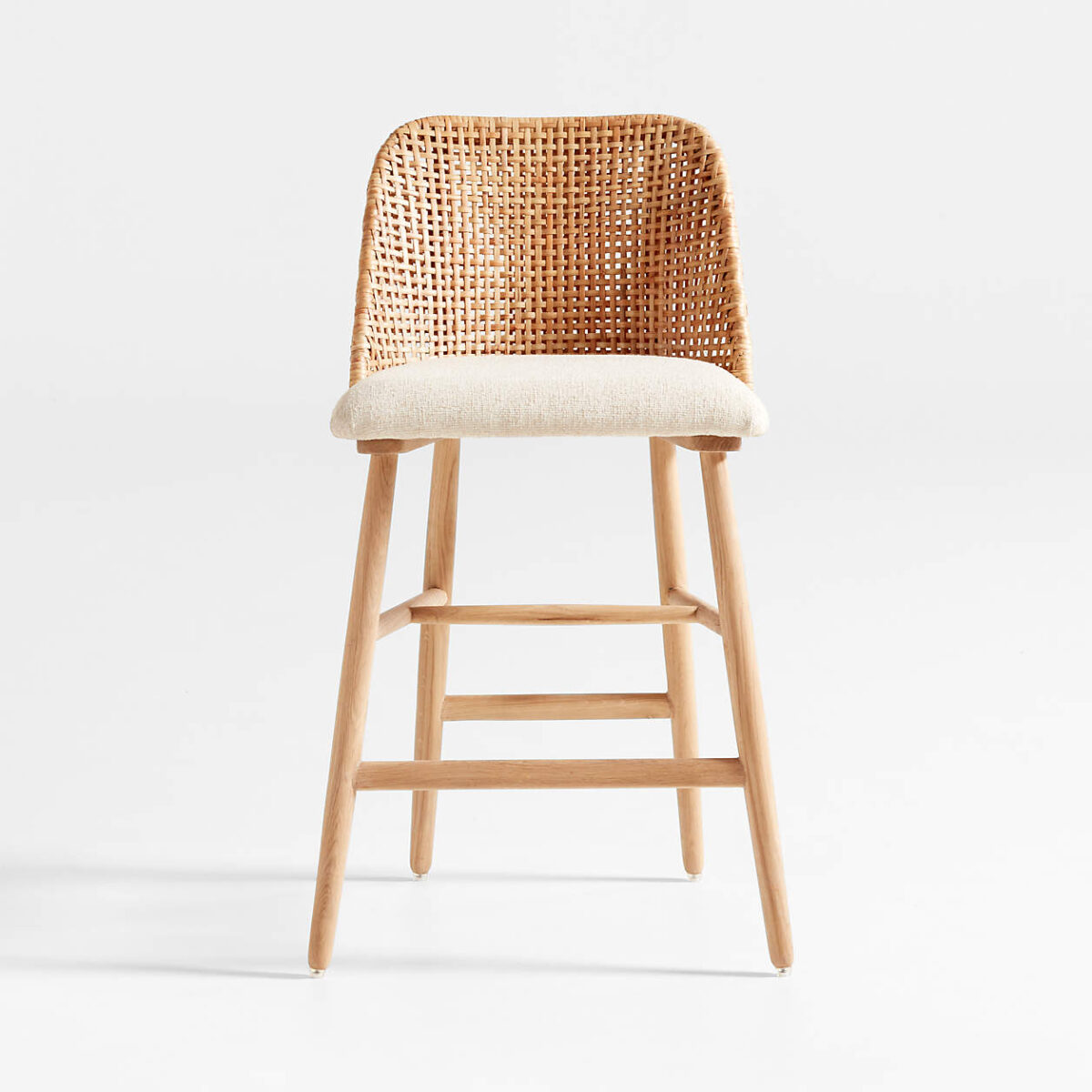 a white cushioned rattan counter stool. 