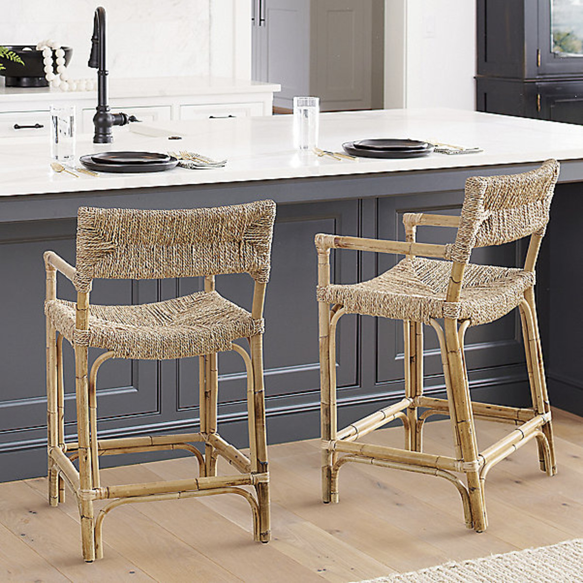 2 woven counter stools at a kitchen island. 