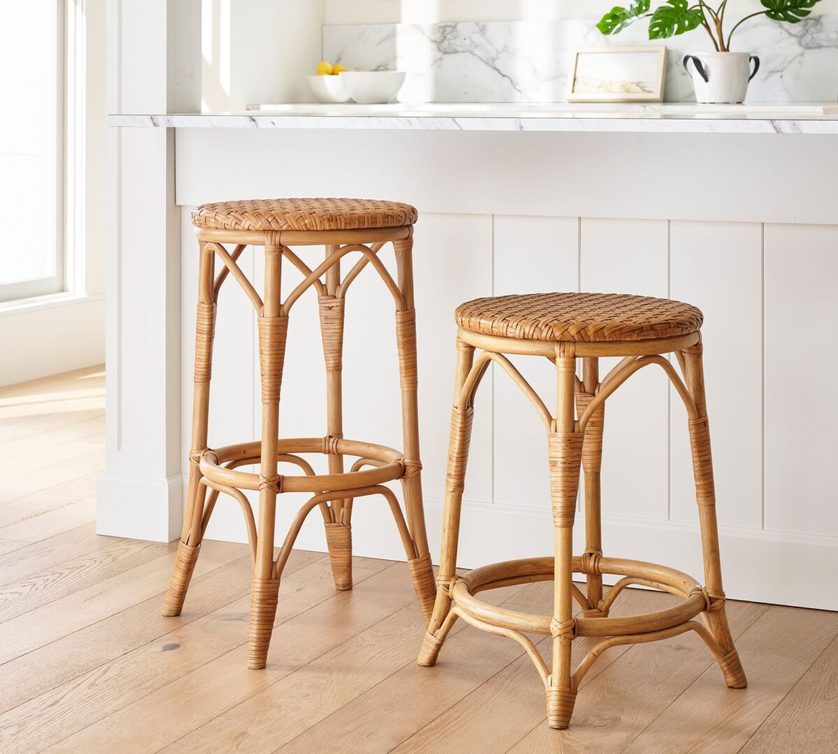 Parisian woven backless bar an counter stools at a kitchen island. 